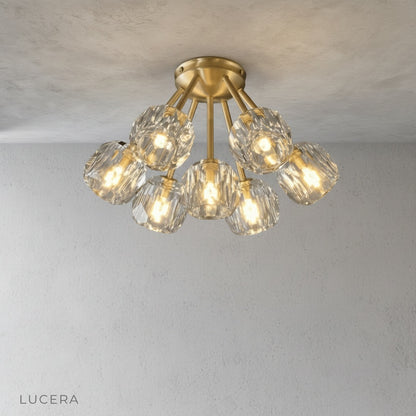 Crylo ceiling light close-up of crystal shade and brass arm detail