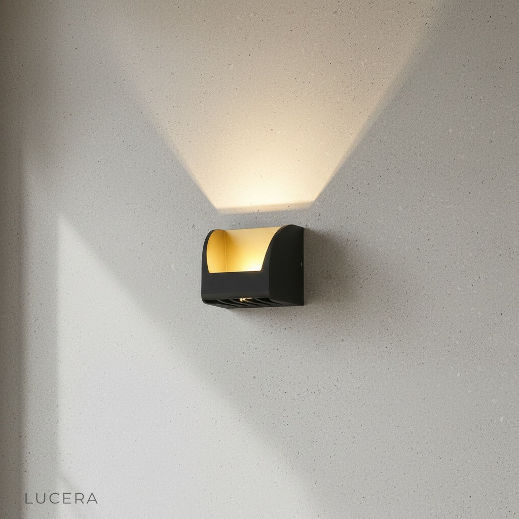 minimalist outdoor wall light with two angled heads against clean white background