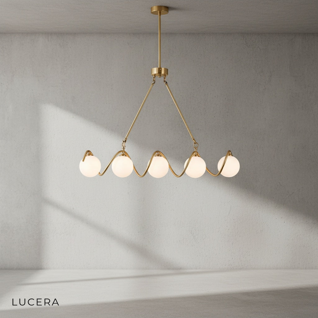 Verdandi chandelier hanging over elegant dining table with soft evening glow