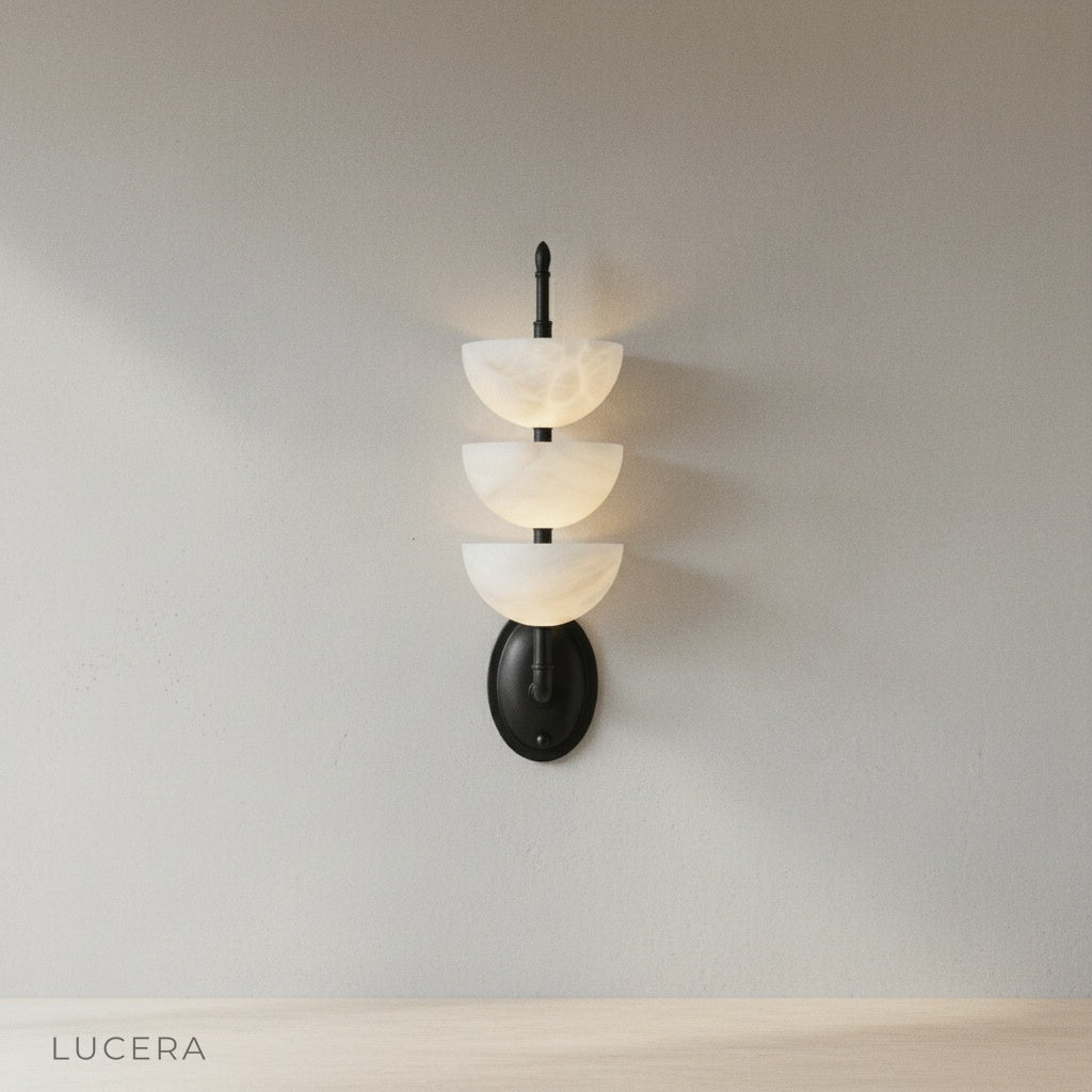 Close-up of Kiel Wall Lamp brass frame and marble texture