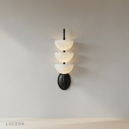 Close-up of Kiel Wall Lamp brass frame and marble texture