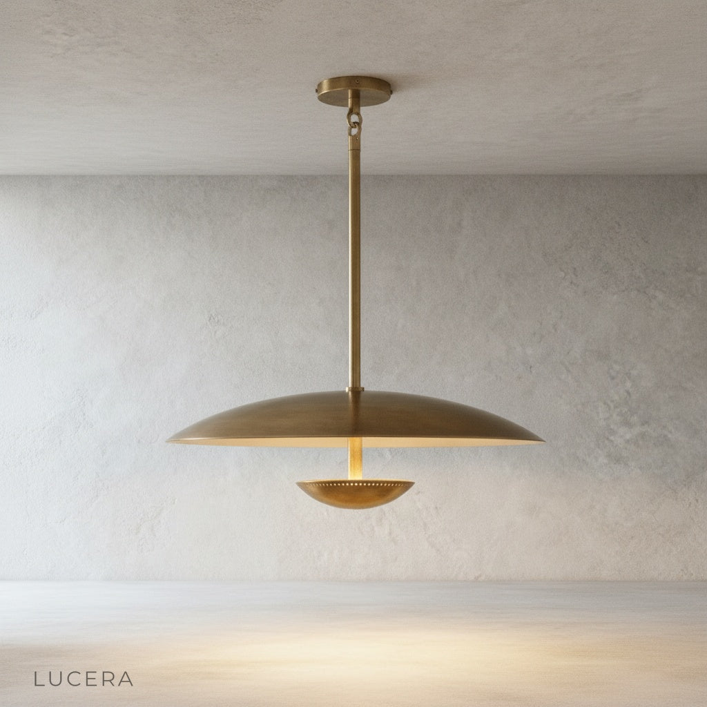 close-up detail of brass finish and central warm structure on Ravish disc pendant light