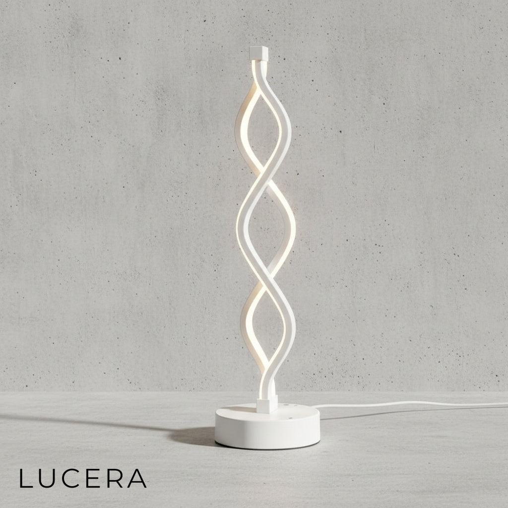 Tristezza lamp in natural light mode, spiral silhouette against soft beige wall