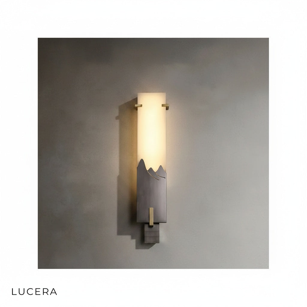 Close-up of warm light casting soft shadows from Axonal marble lamp onto textured wallpaper