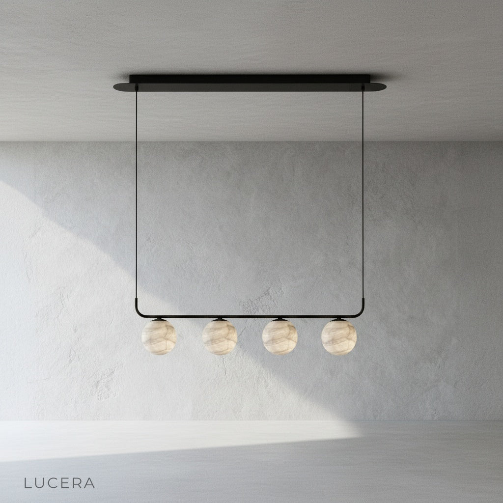 Close-up of Bibelot pendant lamp warm LED light through alabaster diffuser