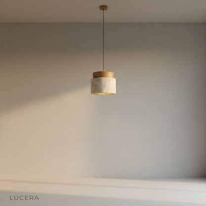 Tenebra ceiling light close-up detail of travertine texture and wood grain cylinder