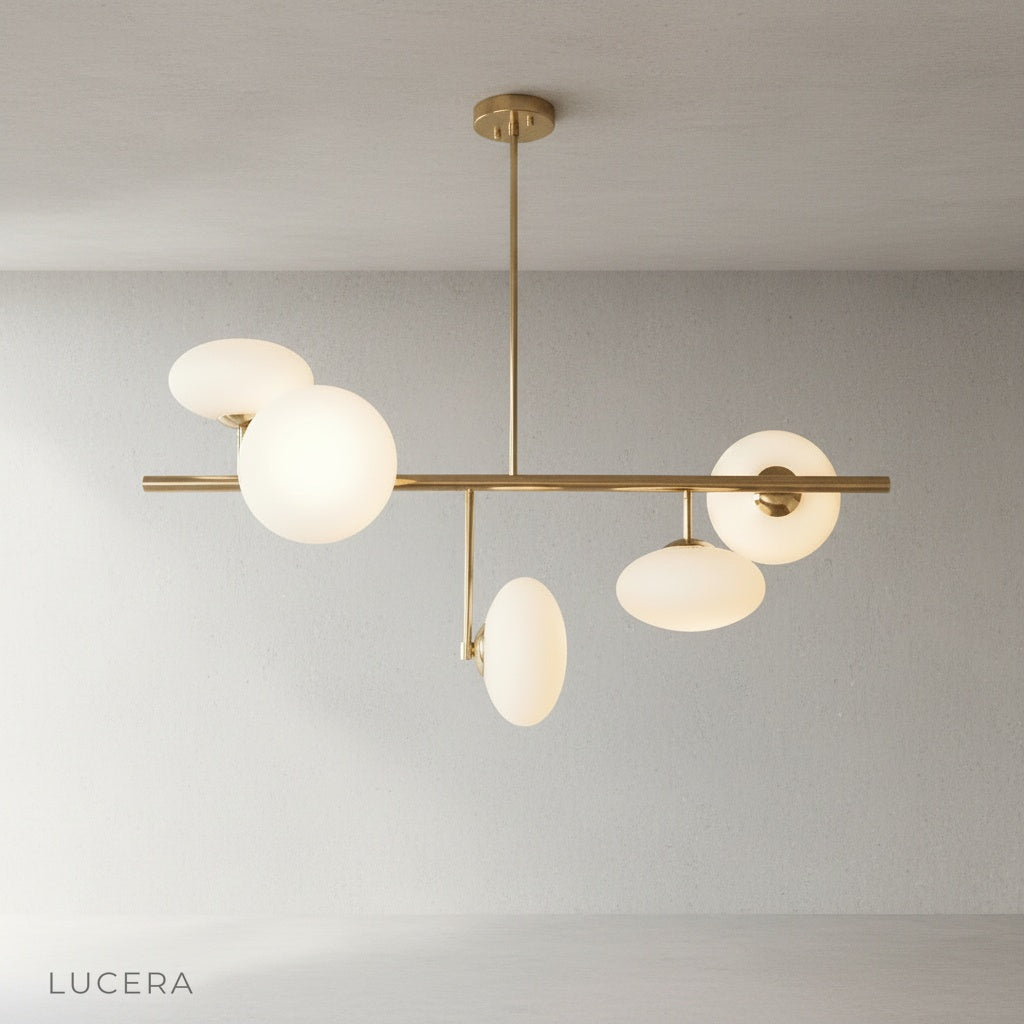 Naples Yellow Chandelier on clean white background showing brass frame and glass details