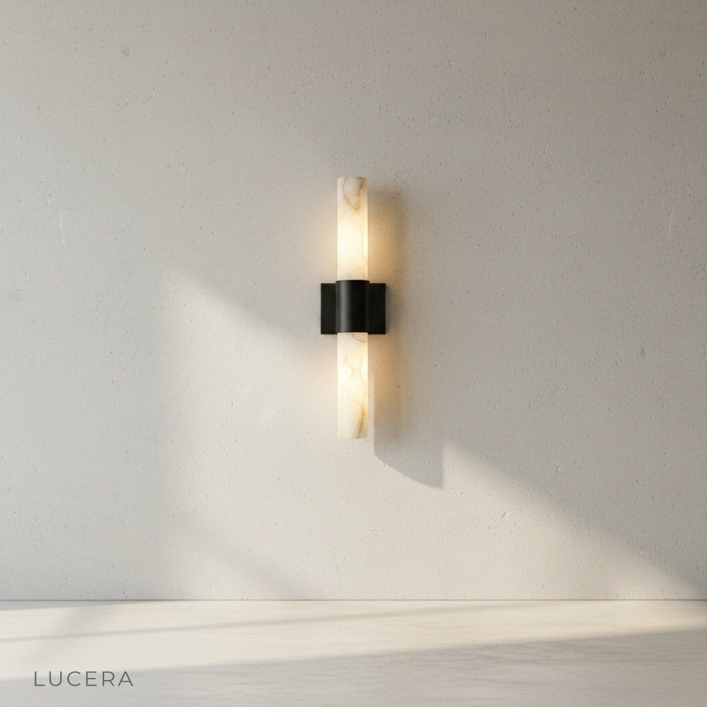 Umbra Alabaster wall sconce side angle studio view showing sleek silhouette