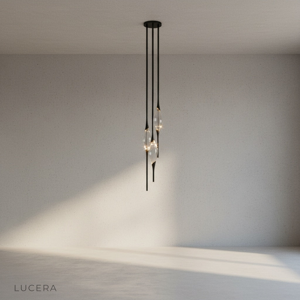 close-up of brushed gold metal body and faceted drop-like crystal detail on Indus light