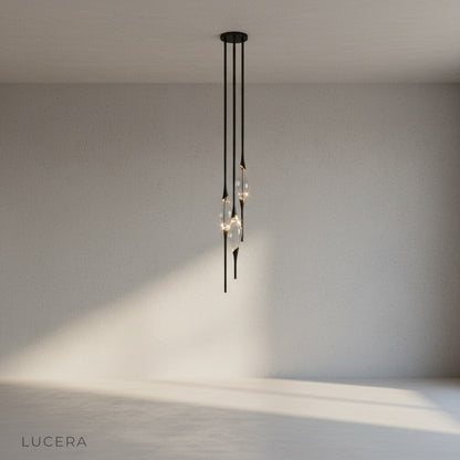 close-up of brushed gold metal body and faceted drop-like crystal detail on Indus light
