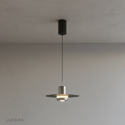 close-up of metal loop accent and ceiling cord on matte black pendant light