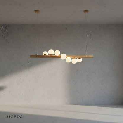 Svartr chandelier with warm LED light illuminating a cozy kitchen island in a Scandinavian home