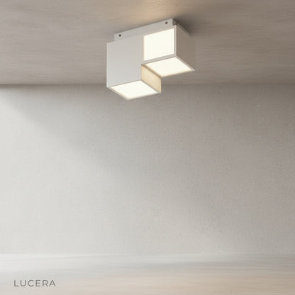 close-up detail of Zelator ceiling light remote dimming control and smooth aluminum surface