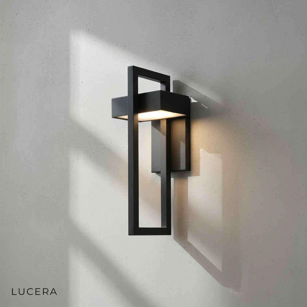 black outdoor lantern above wooden bench in cozy entryway