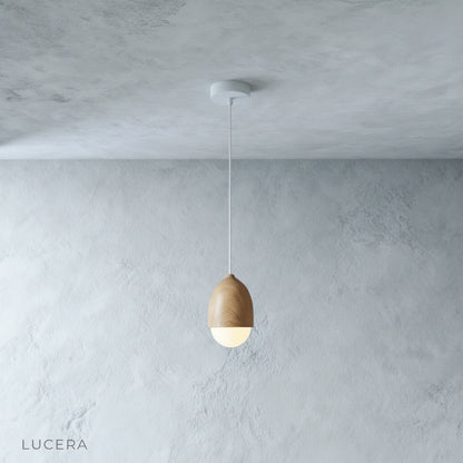 close-up detail of Holly pendant light showing textured wood-grain surface and soft diffuser