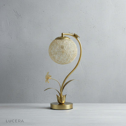 Domenica Table Lamp front view on white backdrop, faux floral accents and butterfly detail