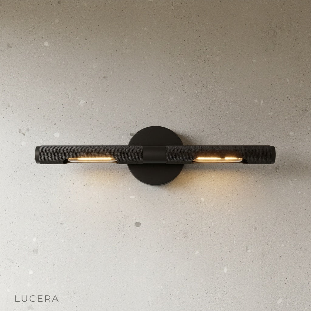 Keziah brass mirror light angled studio view showing slim architectural profile