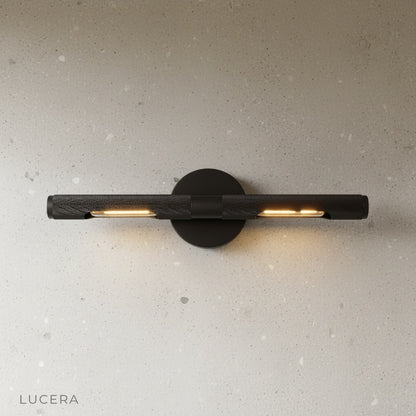 Keziah brass mirror light angled studio view showing slim architectural profile