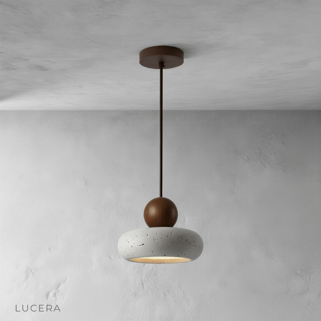 Minimalist studio view of Mensa Pendant Light showing sculptural stone texture