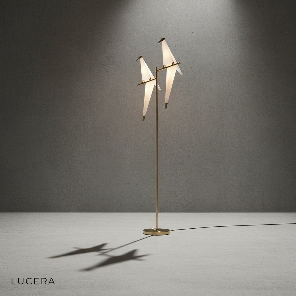 gold parrot floor lamp casting artistic shadows on a neutral wall in a modern interior