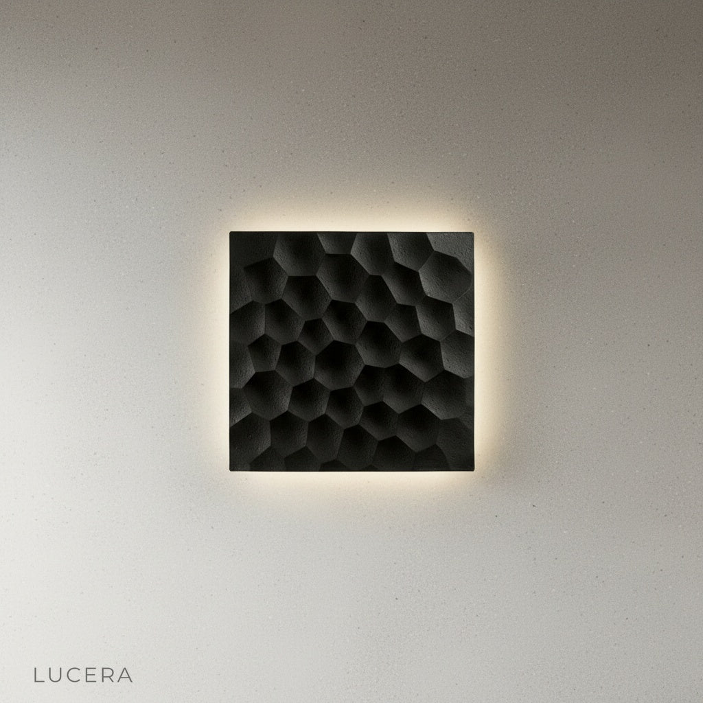 Close-up of textured black travertine surface with warm backlit glow