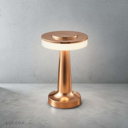 close-up of brushed aluminum body and soft diffused light from circular lampshade