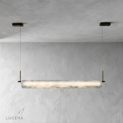 Close-up detail of the natural alabaster stone texture on the Parlor pendant light shade