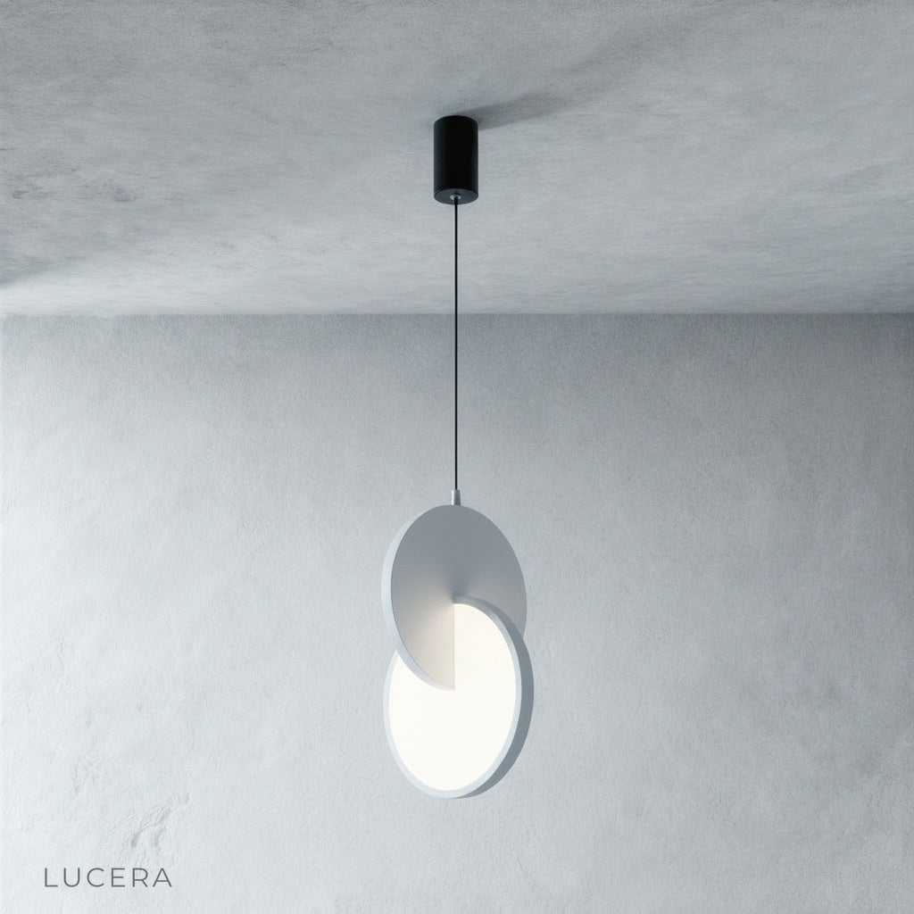 close up detail of overlapping disc joints on modern aluminum and acrylic pendant light