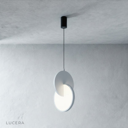 close up detail of overlapping disc joints on modern aluminum and acrylic pendant light