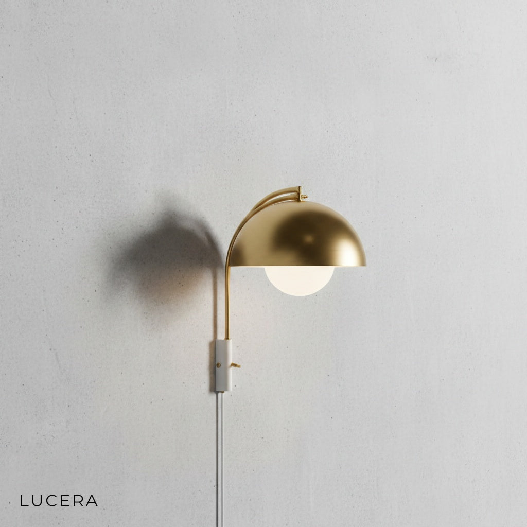 Coronal Nordic wall lamp in white finish with compact silhouette on blank wall