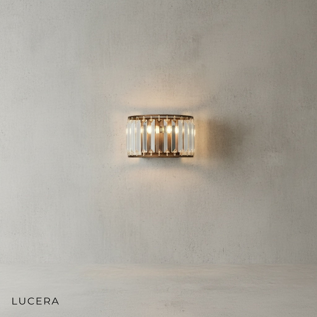 elegant brown crystal sconce casting soft glow beside velvet armchair in cozy lounge
