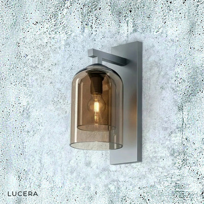 warm LED lighting from dome-shaped wall fixture casting soft ambient shadows on textured wall