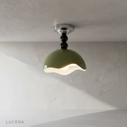 Studio shot of Aegis semi-flush mount ceiling light with glossy aluminum shade