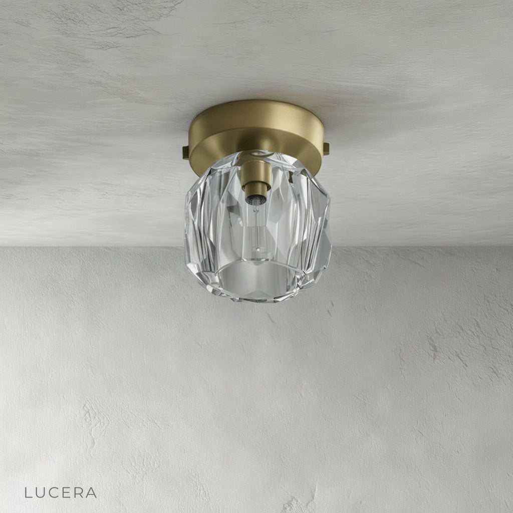 close-up of gold metal ceiling plate and crystal droplet details