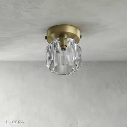 close-up of gold metal ceiling plate and crystal droplet details