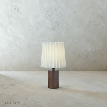 Close-up of Pandora Table Lamp antiqued brass pull chain and solid wood column with visible craftsmanship