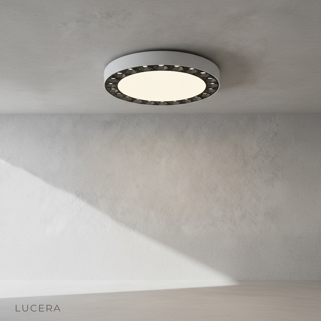 Close-up of Alonzo ceiling light edge detail with dark accent finish against acrylic surface