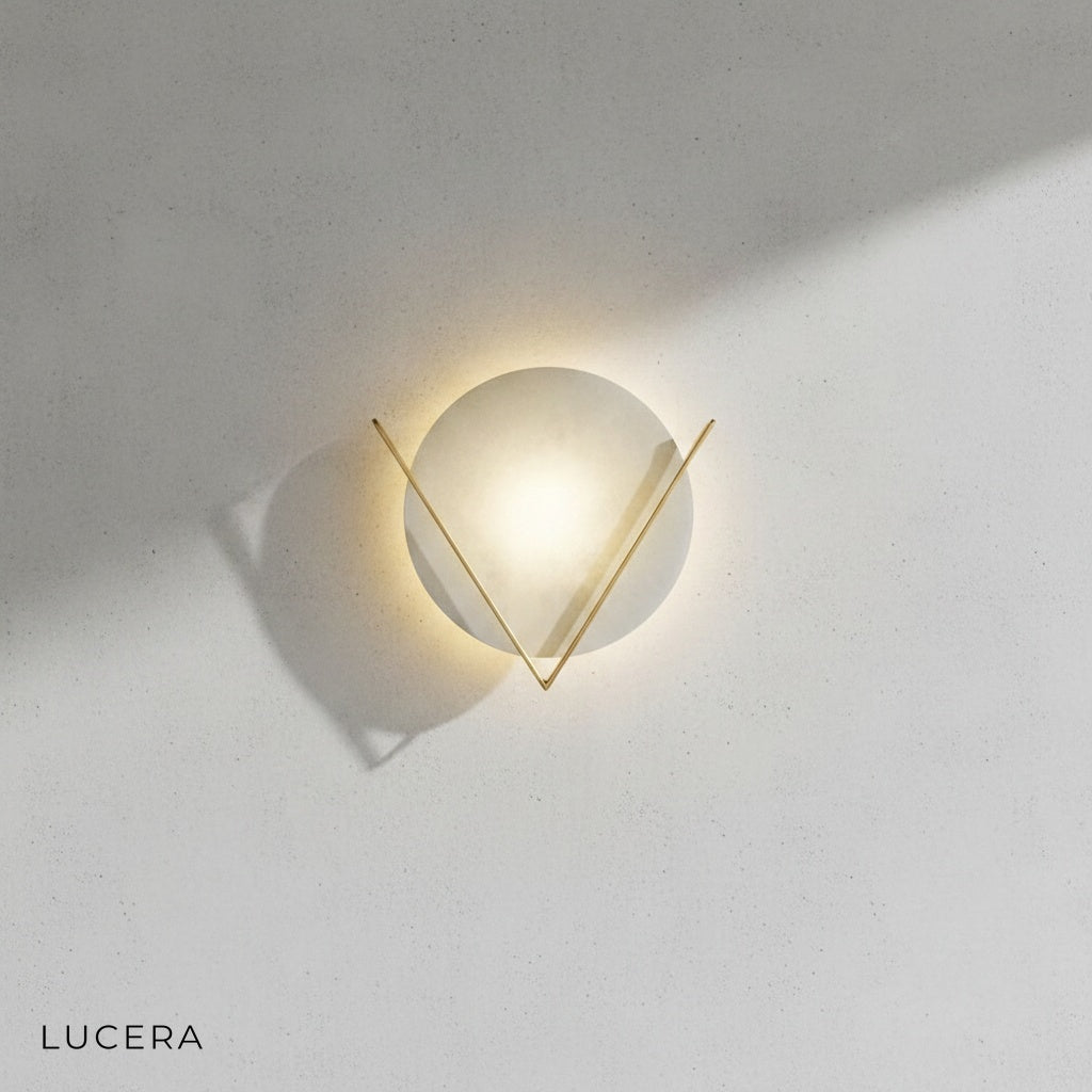 Ventral retro wall lamp illuminating bathroom vanity with warm light and marble tile