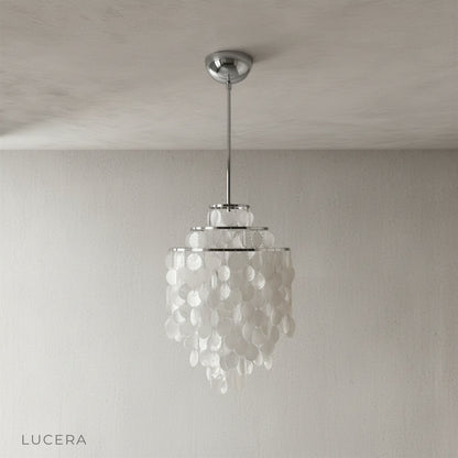 Close-up of Zwing Chandelier Capiz shell discs and brushed metal frame joint detail