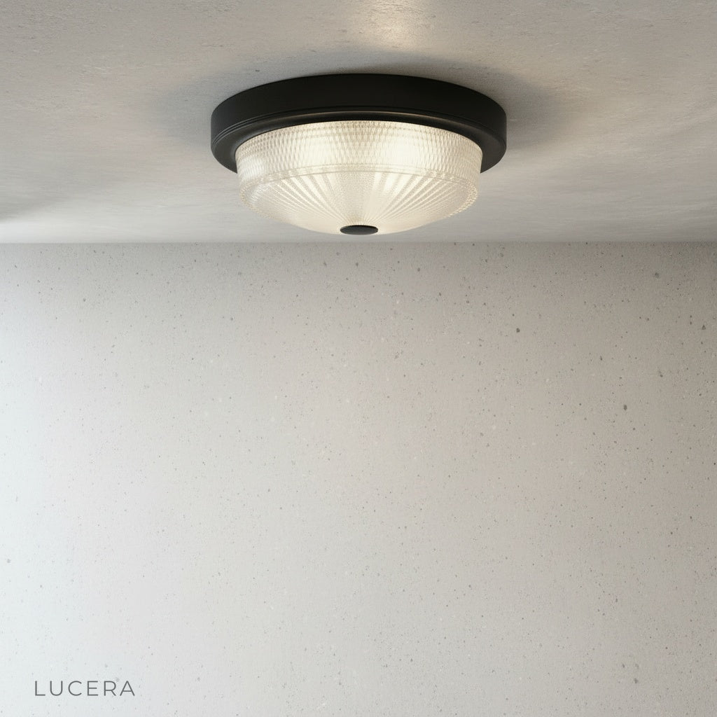 Veneration ceiling light in bronze finish against neutral wall highlighting durable metal construction