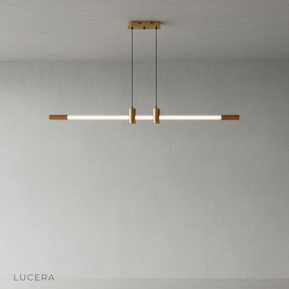 Close-up of Gideon pendant light glass neon tube emitting a subtle warm amber glow