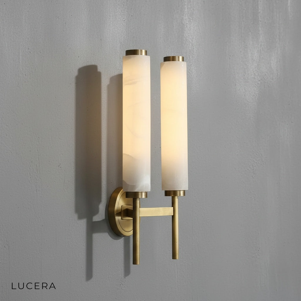 Outre wall lamp with warm white glow highlighting copper and marble materials