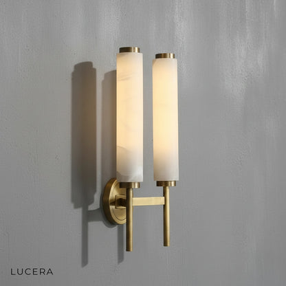 Outre wall lamp with warm white glow highlighting copper and marble materials