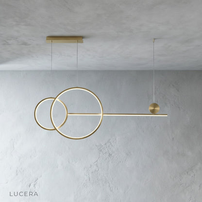 Gold Brumal pendant light close-up showing acrylic and iron ring construction