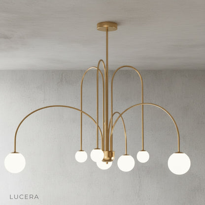 Close-up of hand-blown opal glass globe on Unico Chandelier iron arm