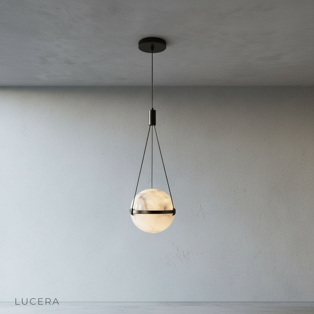 Close-up of hand-crafted alabaster globe shade showing unique veining and warm glow