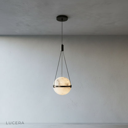 Close-up of hand-crafted alabaster globe shade showing unique veining and warm glow