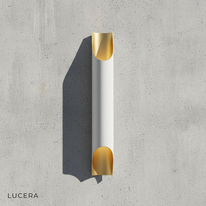 Crema single light wall lamp mounted above a modern bedside table in a bright bedroom setting