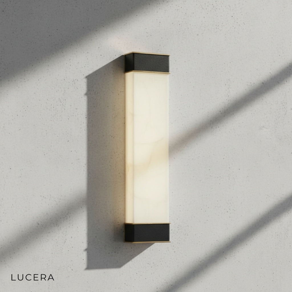 copper and marble wall light illuminating hallway with soft 3000K ambiance
