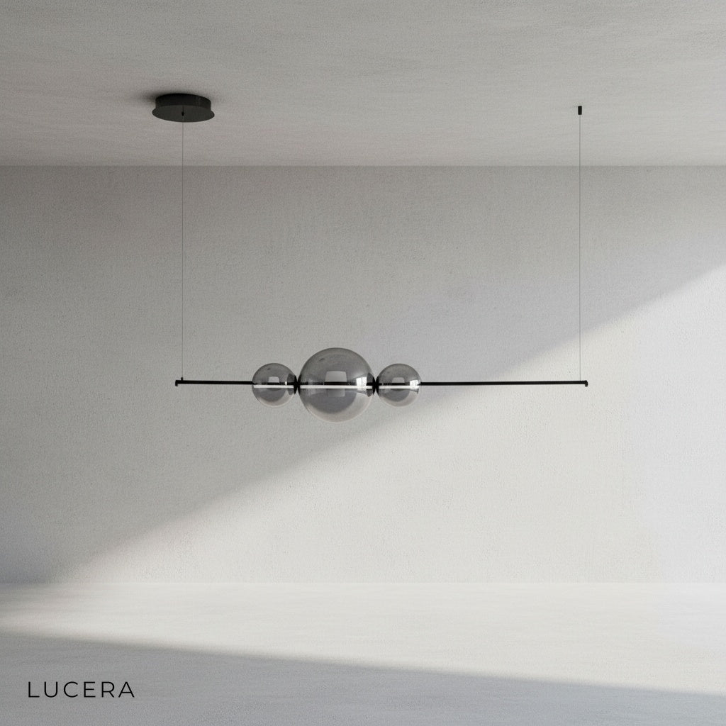Bjorn chandelier in matte black finish suspended in a bright white studio room